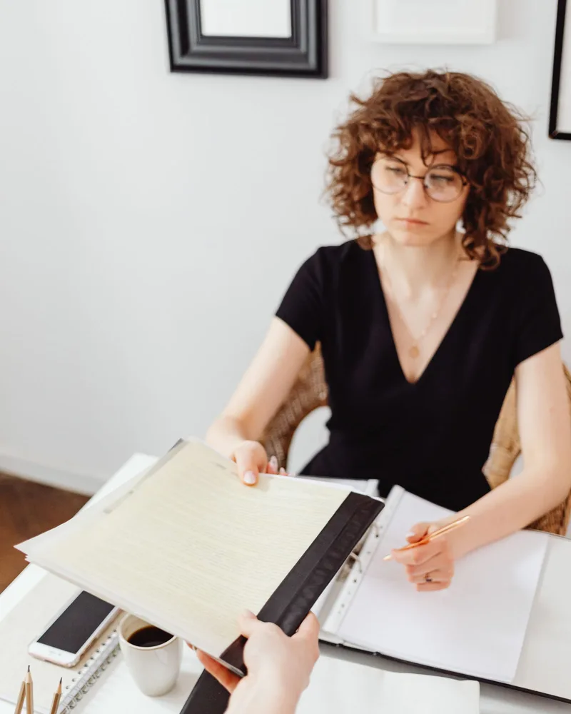 Reviewing trade documentation at a desk